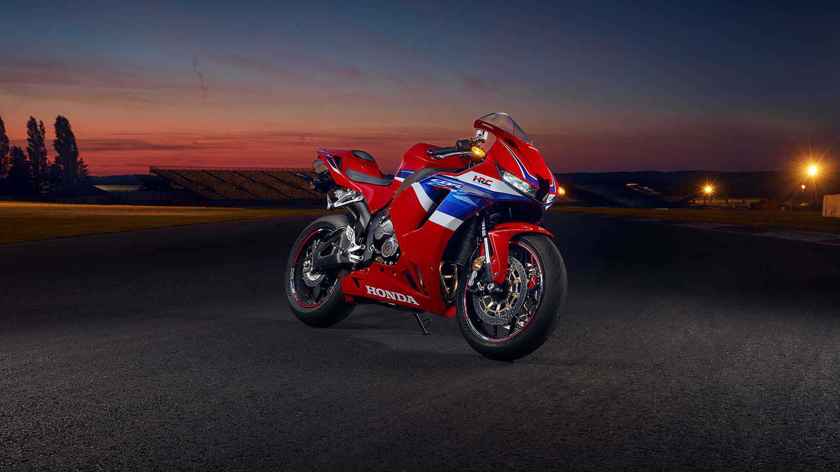 CBR600RR on track at sunset.